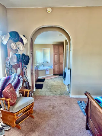 a view of a hallway with a painting on the wall