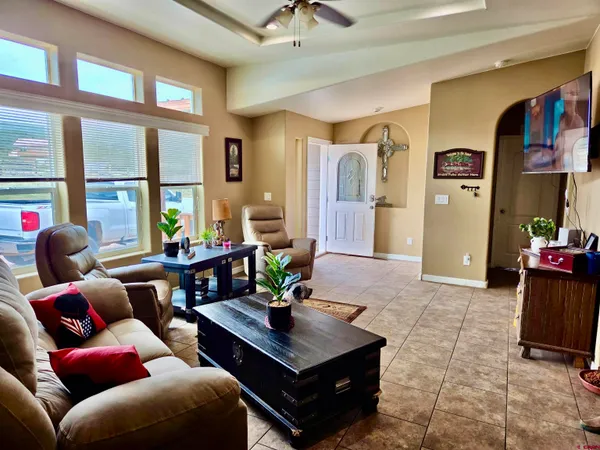 a living room with furniture and a large window