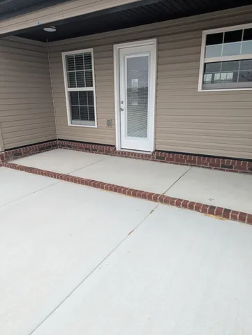 a view of a house with a street