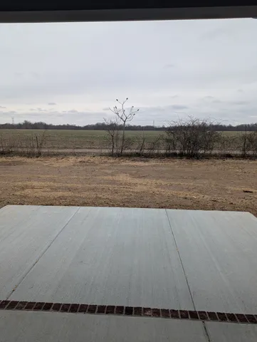 a view of ocean with a large bridge
