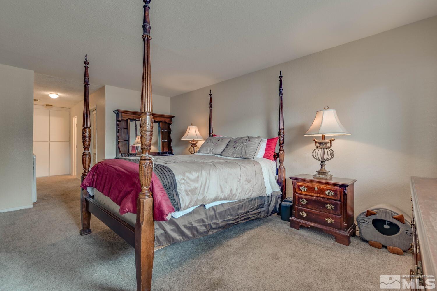 2300 Dickerson Road, Unit 73 Reno, NV 89503 - Photo 13 of 25 a bed room with a bed and a night stand