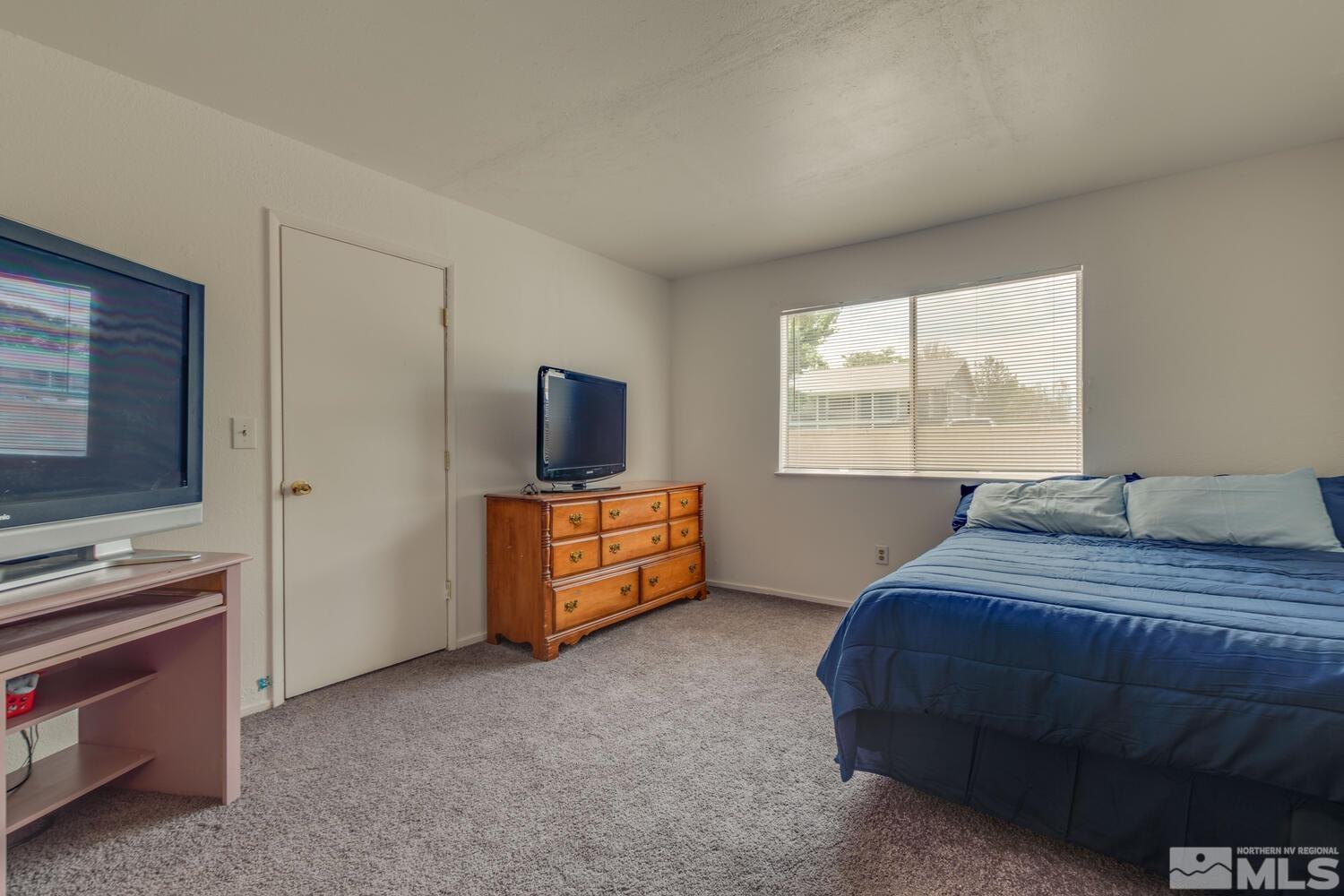 2300 Dickerson Road, Unit 73 Reno, NV 89503 - Photo 16 of 25 a bedroom with bed and window