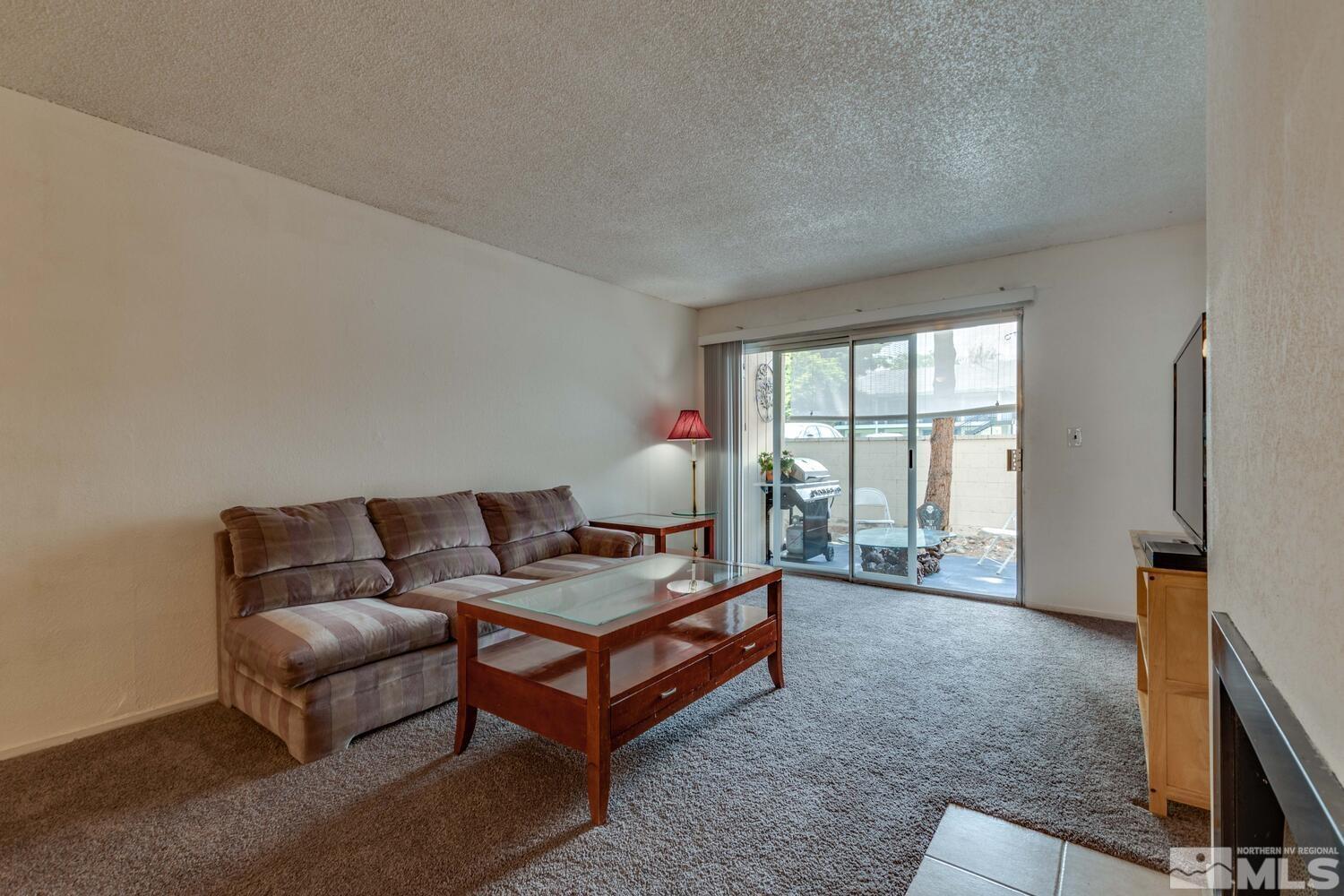 2300 Dickerson Road, Unit 73 Reno, NV 89503 - Photo 3 of 25 a living room with furniture and a window