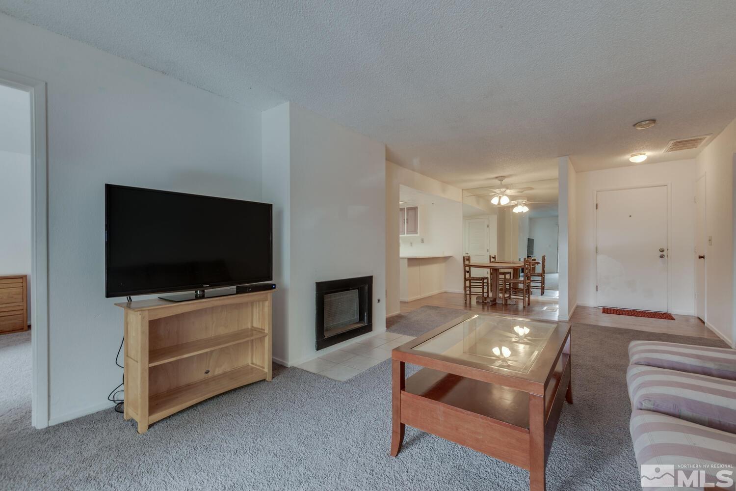 2300 Dickerson Road, Unit 73 Reno, NV 89503 - Photo 5 of 25 a living room with furniture and a flat screen tv