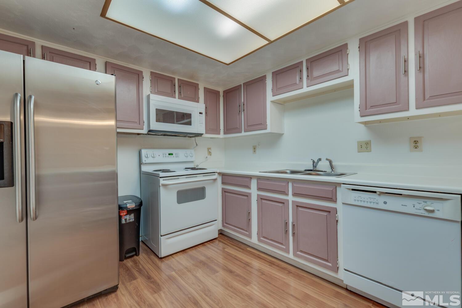 2300 Dickerson Road, Unit 73 Reno, NV 89503 - Photo 7 of 25 a kitchen with cabinets stainless steel appliances and a counter space