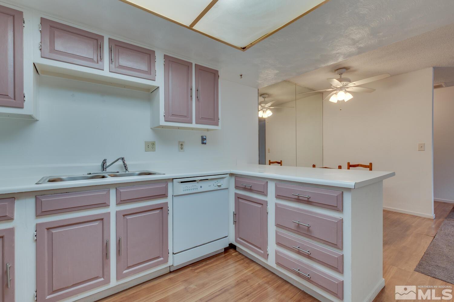 2300 Dickerson Road, Unit 73 Reno, NV 89503 - Photo 8 of 25 a kitchen with a sink cabinets and appliances