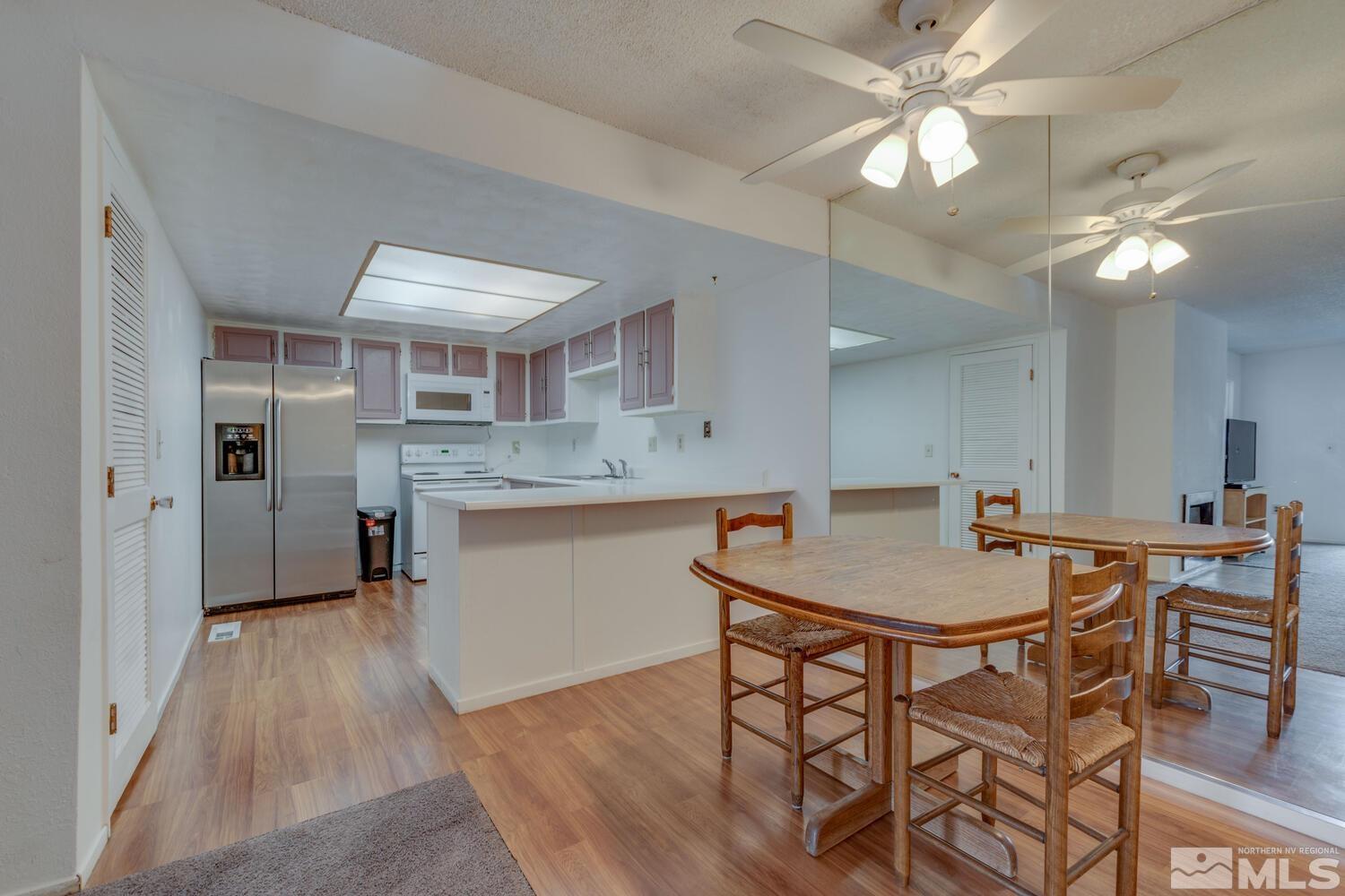 2300 Dickerson Road, Unit 73 Reno, NV 89503 - Photo 9 of 25 a kitchen with a table and chairs in it