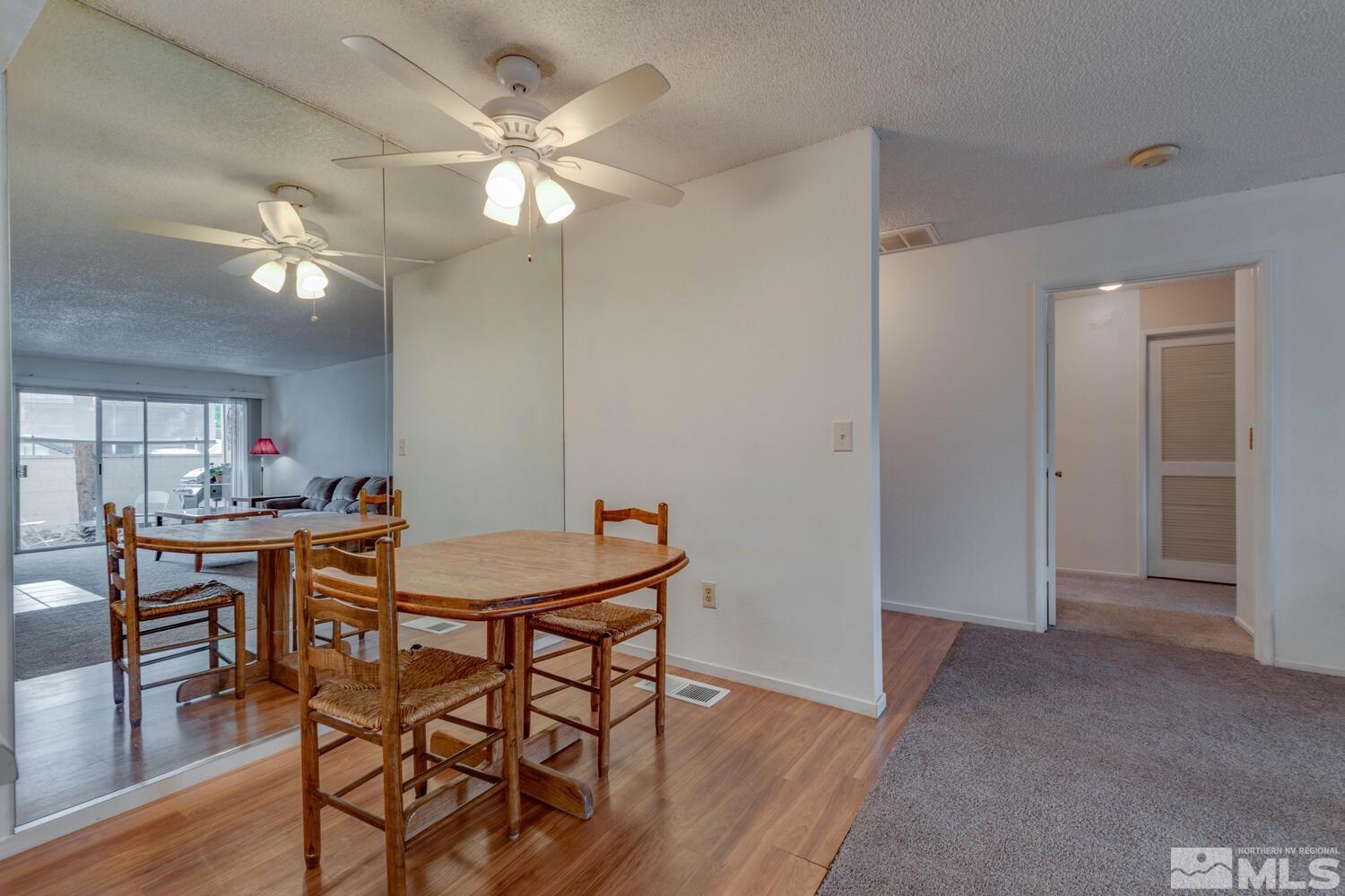 2300 Dickerson Road, Unit 73 Reno, NV 89503 - Photo 10 of 25 a view of a dining room with furniture and wooden floor