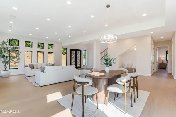 a kitchen with a stove and white cabinets