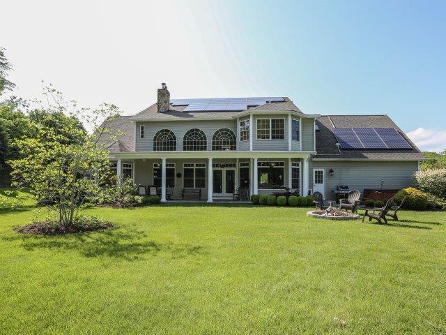 151 Huntingtown Road Newtown, CT 06470 - Photo 1 of 1 a front view of a house with patio