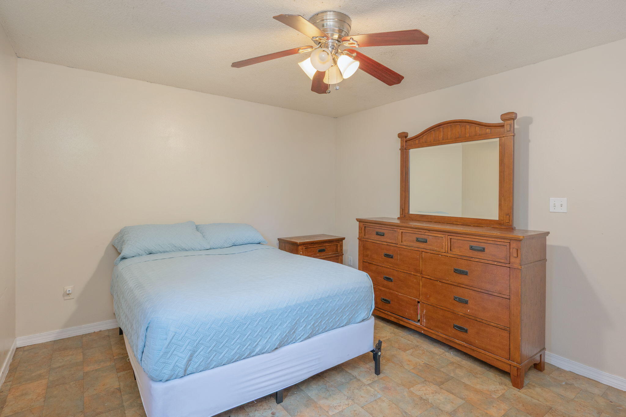 834 McDonald Street Crestview, FL 32536 - Photo 11 of 35 a bedroom with a bed and a dresser