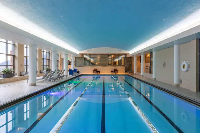 a view of a swimming pool with a table and chairs