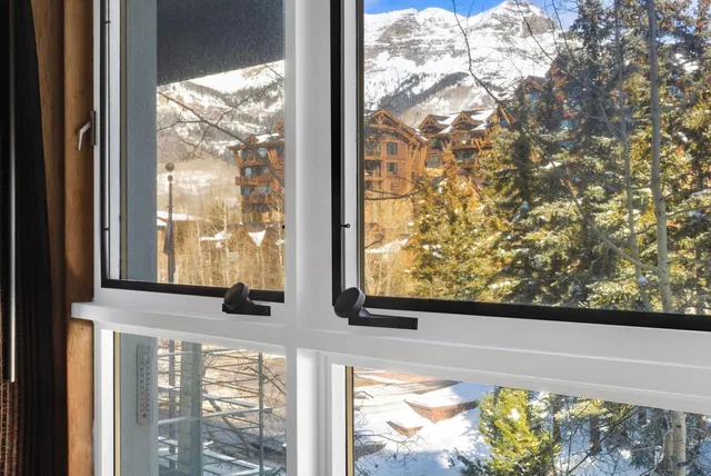 a view of room with workspace and a window