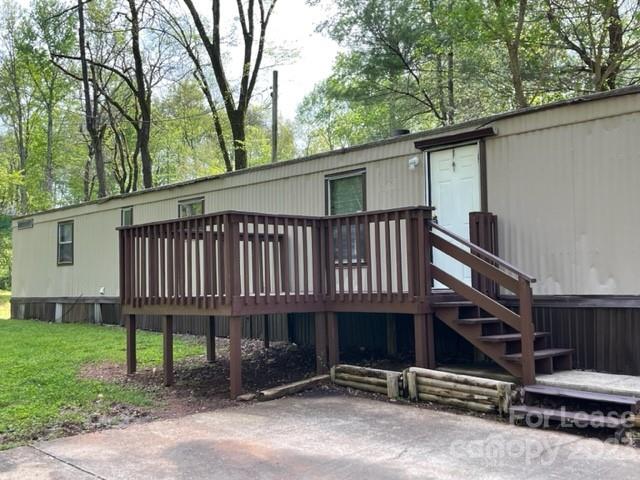145 Merriman Road Statesville, NC 28625 - Photo 12 of 24 a view of a house with a yard and wooden fence
