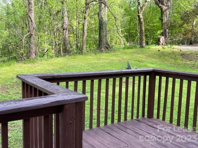 145 Merriman Road Statesville, NC 28625 - Photo 13 of 24 a view of a wooden deck and a backyard