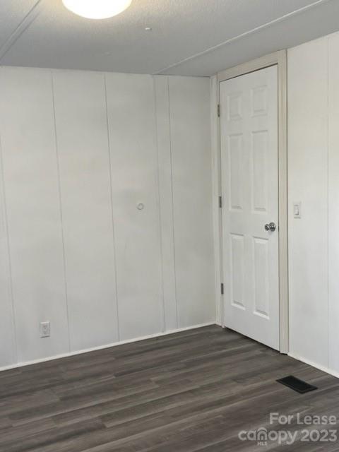 145 Merriman Road Statesville, NC 28625 - Photo 16 of 24 a view of an empty room with wooden floor