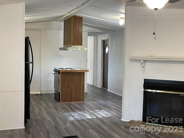 145 Merriman Road Statesville, NC 28625 - Photo 5 of 24 a living room with a fireplace and a wooden floor