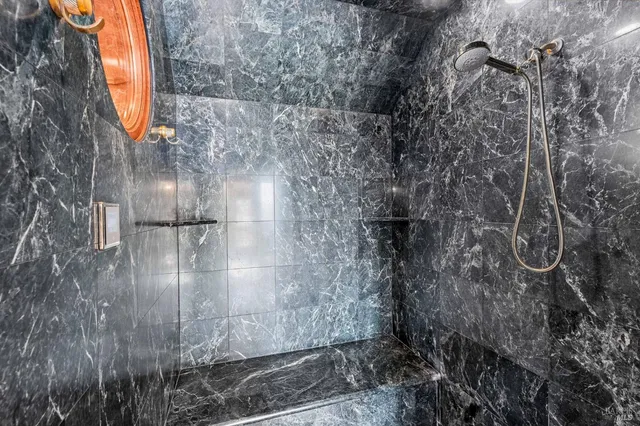 a living room with pool table and a flat screen tv