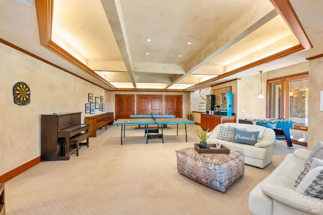 a view of a swimming pool with an outdoor space and seating area