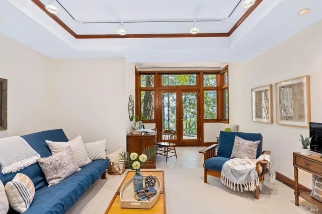a view of balcony with furniture and wooden floor