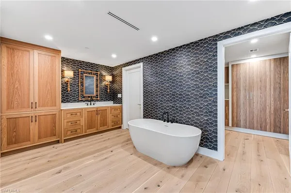 a large room with wooden floor and windows