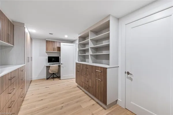a kitchen with a refrigerator and a sink