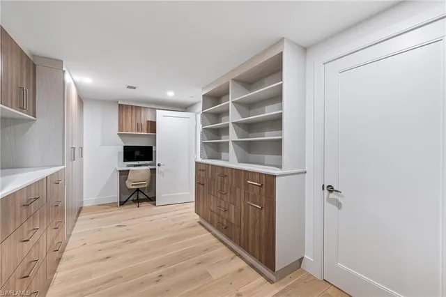 a kitchen with a refrigerator and a sink