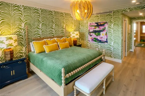 a bedroom with a bed and a dresser