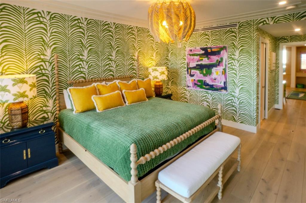 13945 Old Coast Road, Unit 905 Naples, FL 34110 - Photo 18 of 39 a bedroom with a bed and a dresser