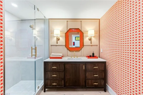 a bathroom with a sink and a mirror