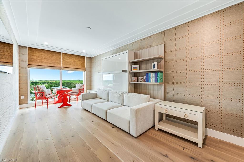 13945 Old Coast Road, Unit 905 Naples, FL 34110 - Photo 23 of 39 a living room with furniture and a large window