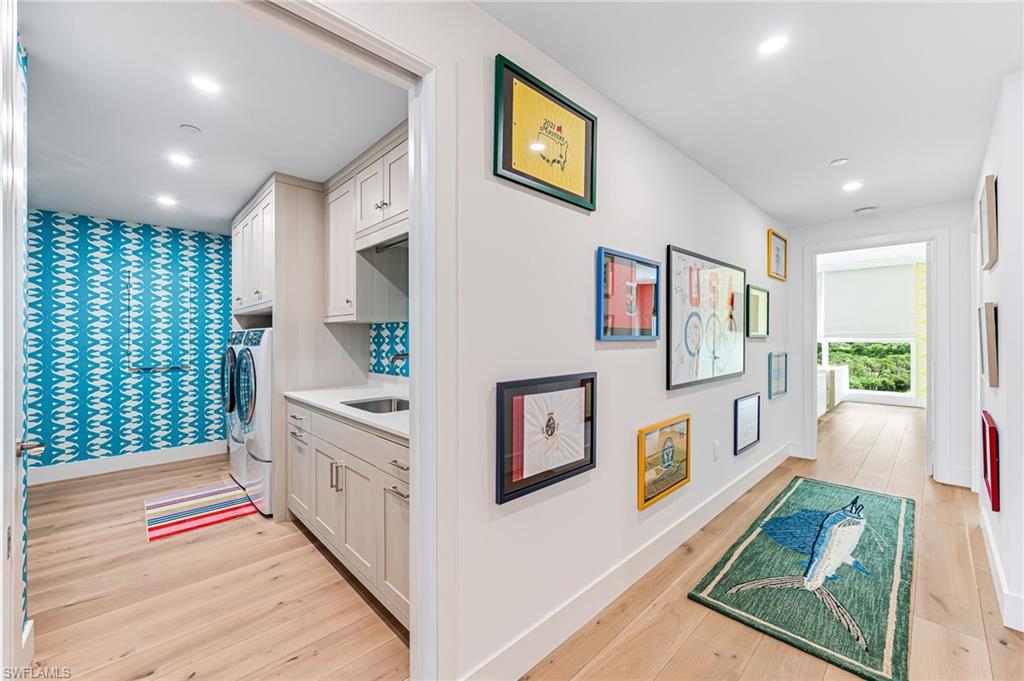 13945 Old Coast Road, Unit 905 Naples, FL 34110 - Photo 24 of 39 a living room with furniture and a flat screen tv