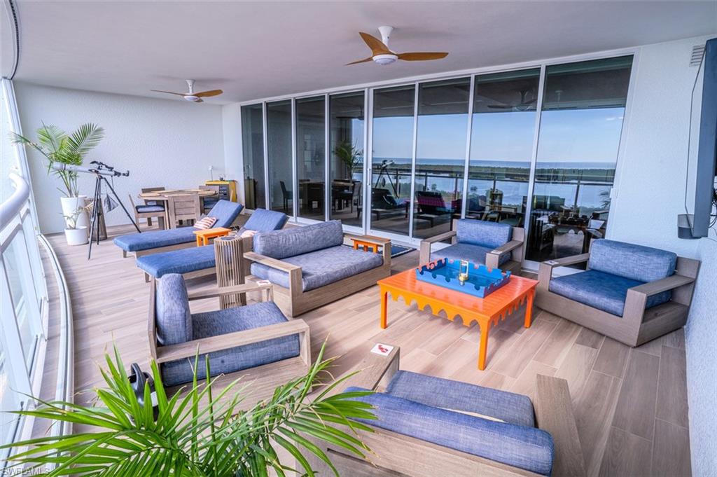 13945 Old Coast Road, Unit 905 Naples, FL 34110 - Photo 26 of 39 a outdoor living space with patio furniture and garden view