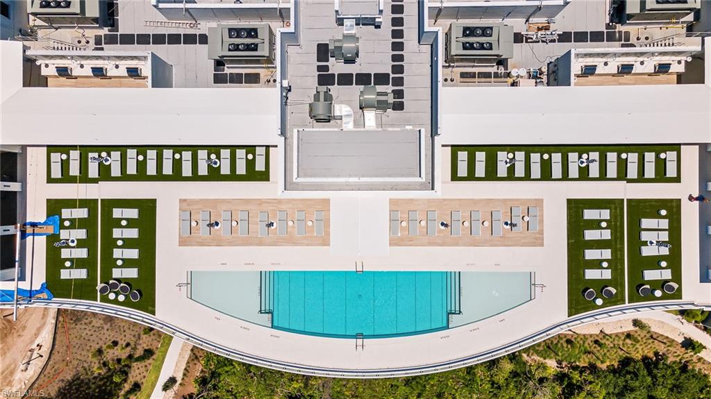 13945 Old Coast Road, Unit 905 Naples, FL 34110 - Photo 28 of 39 a view of a kitchen with furniture and stainless steel appliances