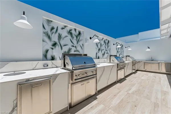a view of a kitchen with cabinets and wooden floor