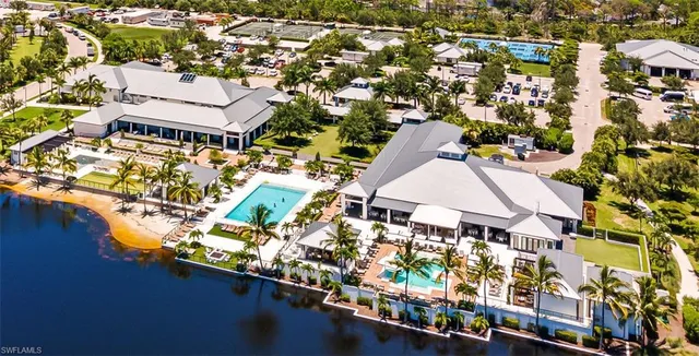 a balcony with furniture and large windows