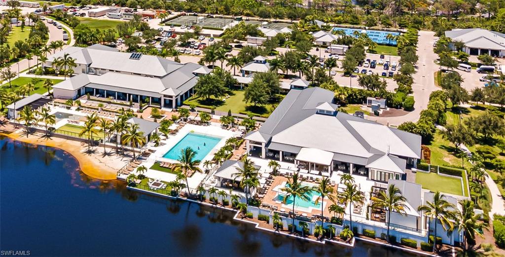 13945 Old Coast Road, Unit 905 Naples, FL 34110 - Photo 37 of 39 an aerial view of residential houses with outdoor space and parking