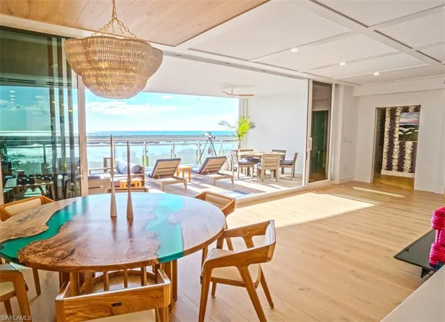 a dining room with table and chairs