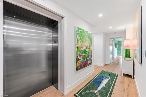 a hallway with a dining table and a entryway