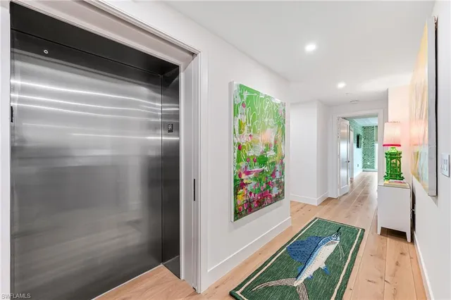 a hallway with a dining table and a entryway