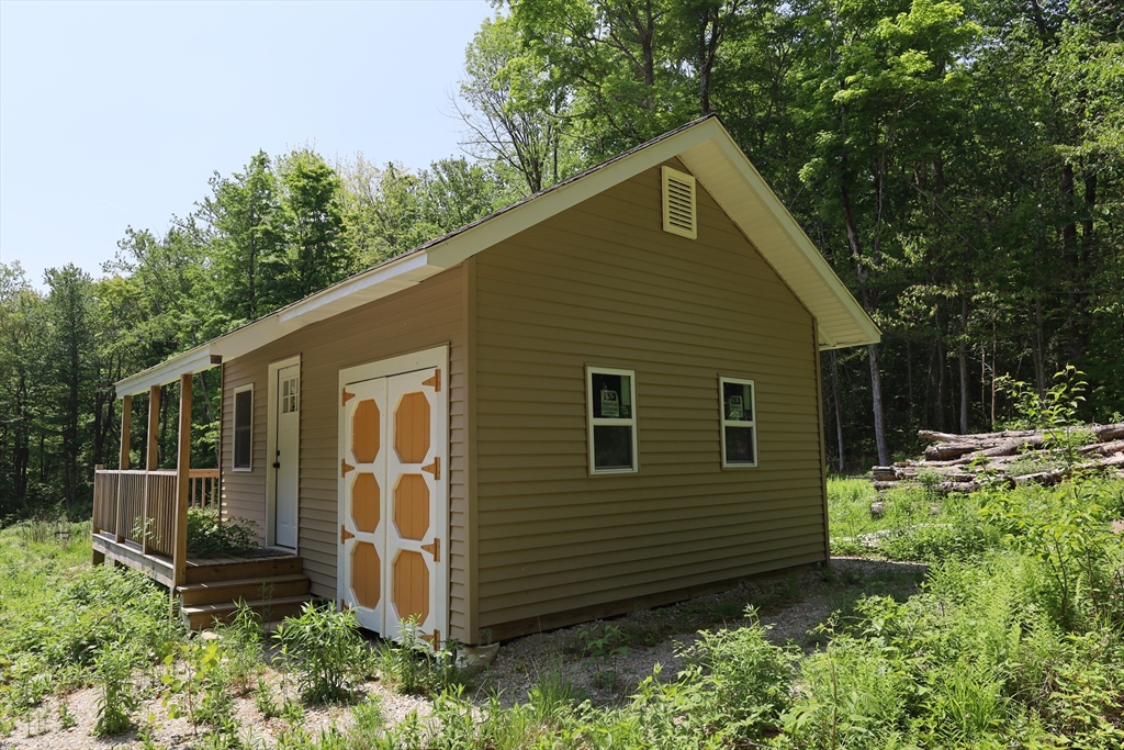 Lot 3 Yokum Pond Road Becket, MA 01223 - Photo 11 of 35 a backyard of a house with lots of green space