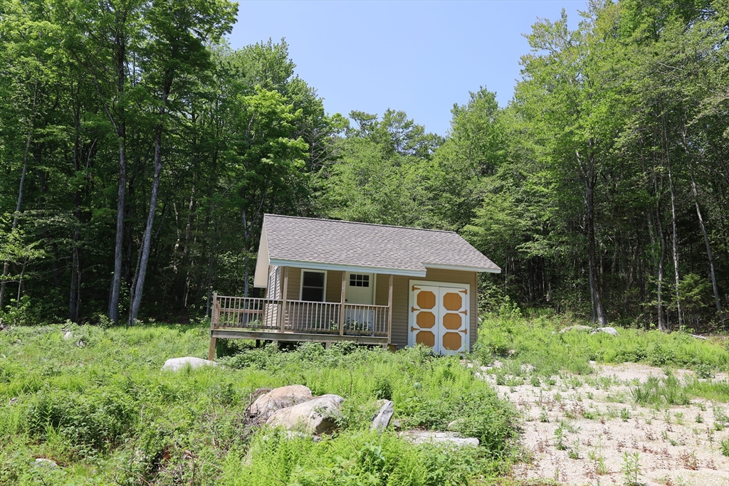 Lot 3 Yokum Pond Road Becket, MA 01223 - Photo 14 of 35 a front view of a house with garden