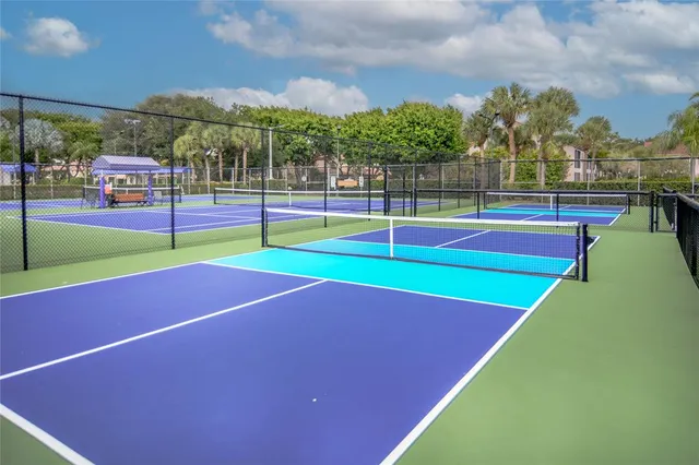 a dining room with furniture a large window and a table
