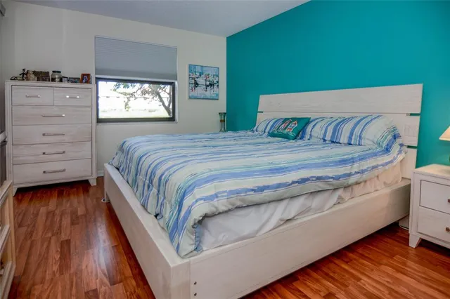 a bedroom with a bed and a dresser