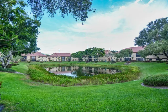 a front view of a house with a yard table and chairs