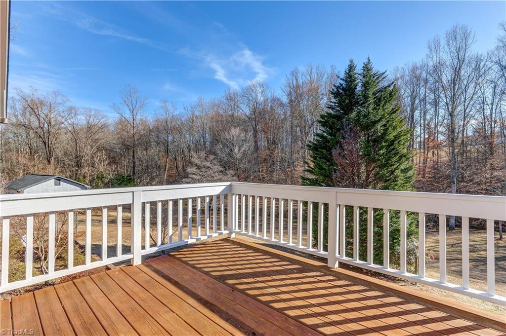 761 Hudson Road Summerfield, NC 27358 - Photo 14 of 28 The private deck off the Master Bedroom. Views are toward Troublesome Creek.