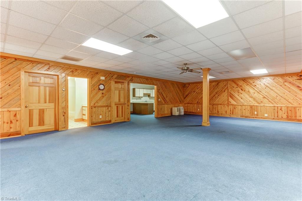 761 Hudson Road Summerfield, NC 27358 - Photo 18 of 28 Another view of the Basement Bonus Room with views toward the full kitchen.