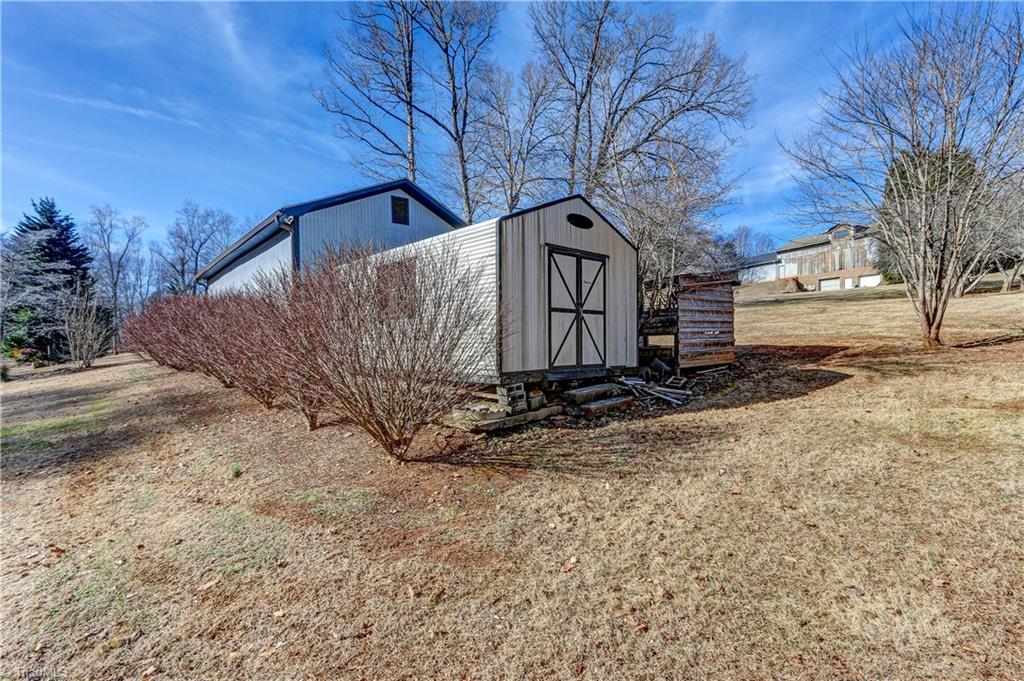 761 Hudson Road Summerfield, NC 27358 - Photo 26 of 28 Lean-to with three bays is ideal for tractor storage. Leonard metal storage shed.