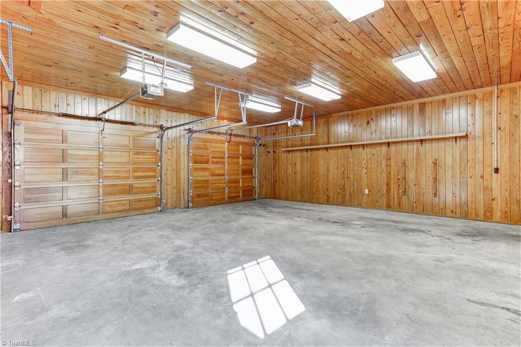 761 Hudson Road Summerfield, NC 27358 - Photo 10 of 28 The two car attached garage is finished throughout with Tongue and Groove wood ceiling and walls. Plenty of light for whatever your needs. Clean concrete floors.
