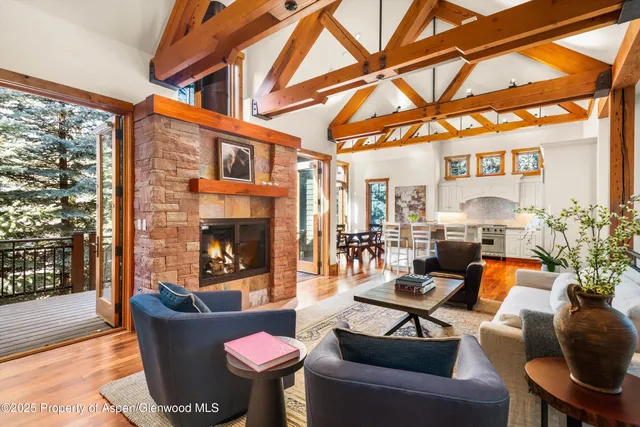 a outdoor living space with patio furniture and a fireplace